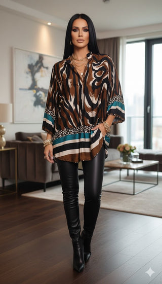 🐆 WILD ELEGANCE: LEO-PRINT BLUSE IN LONG-FORM MIT PETROL-AKZENTEN